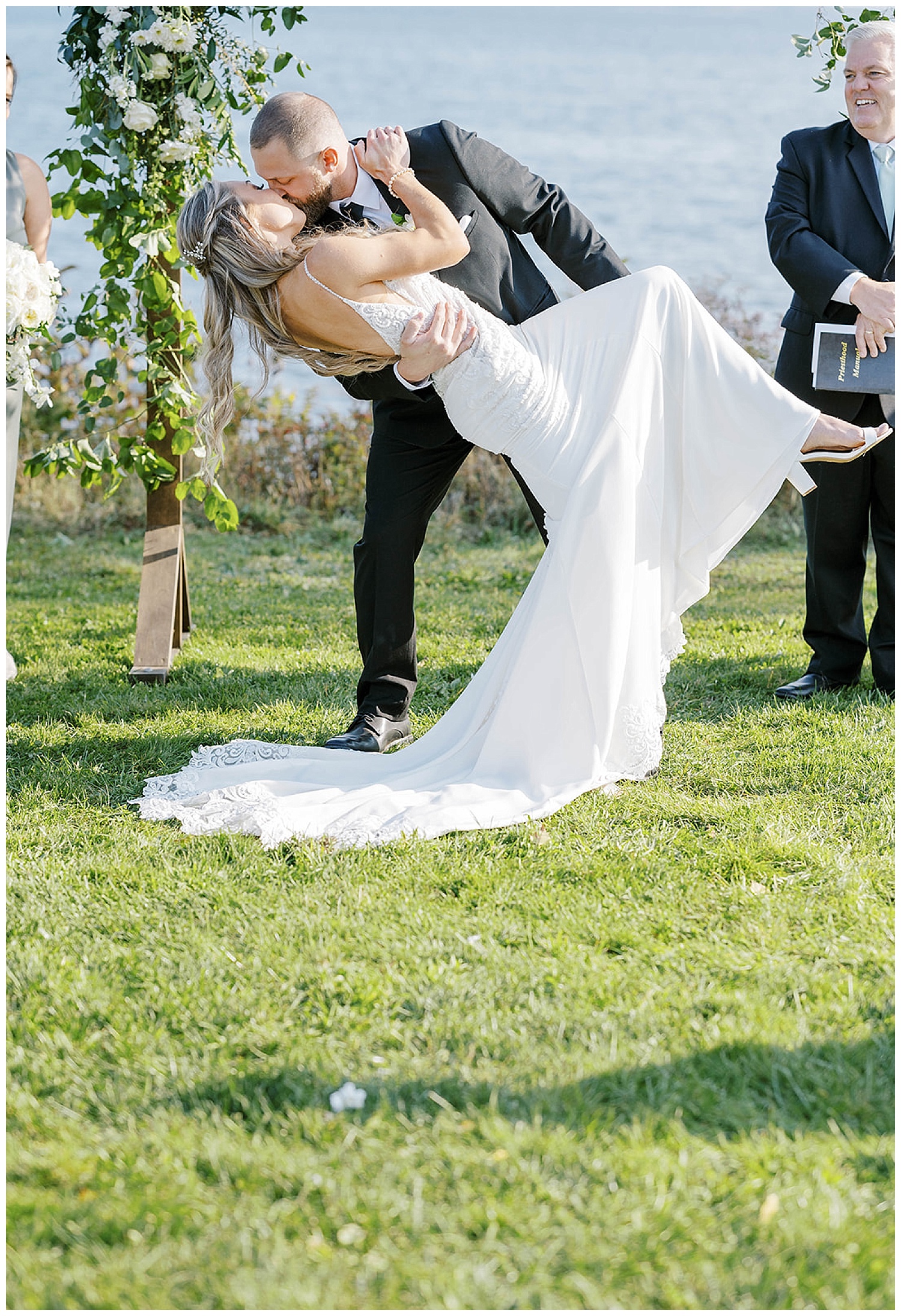groom dipping bride back for a kiss