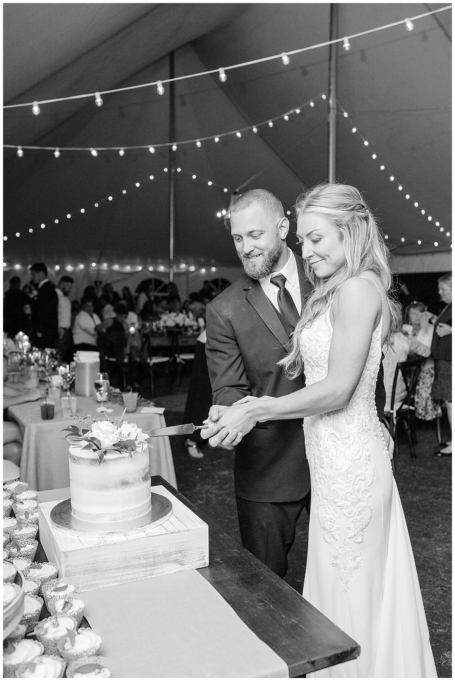 bride and groom cutting cake at wedding