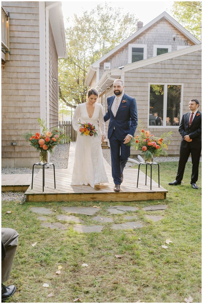 groom and bride at wedding ceremony outside in Maine