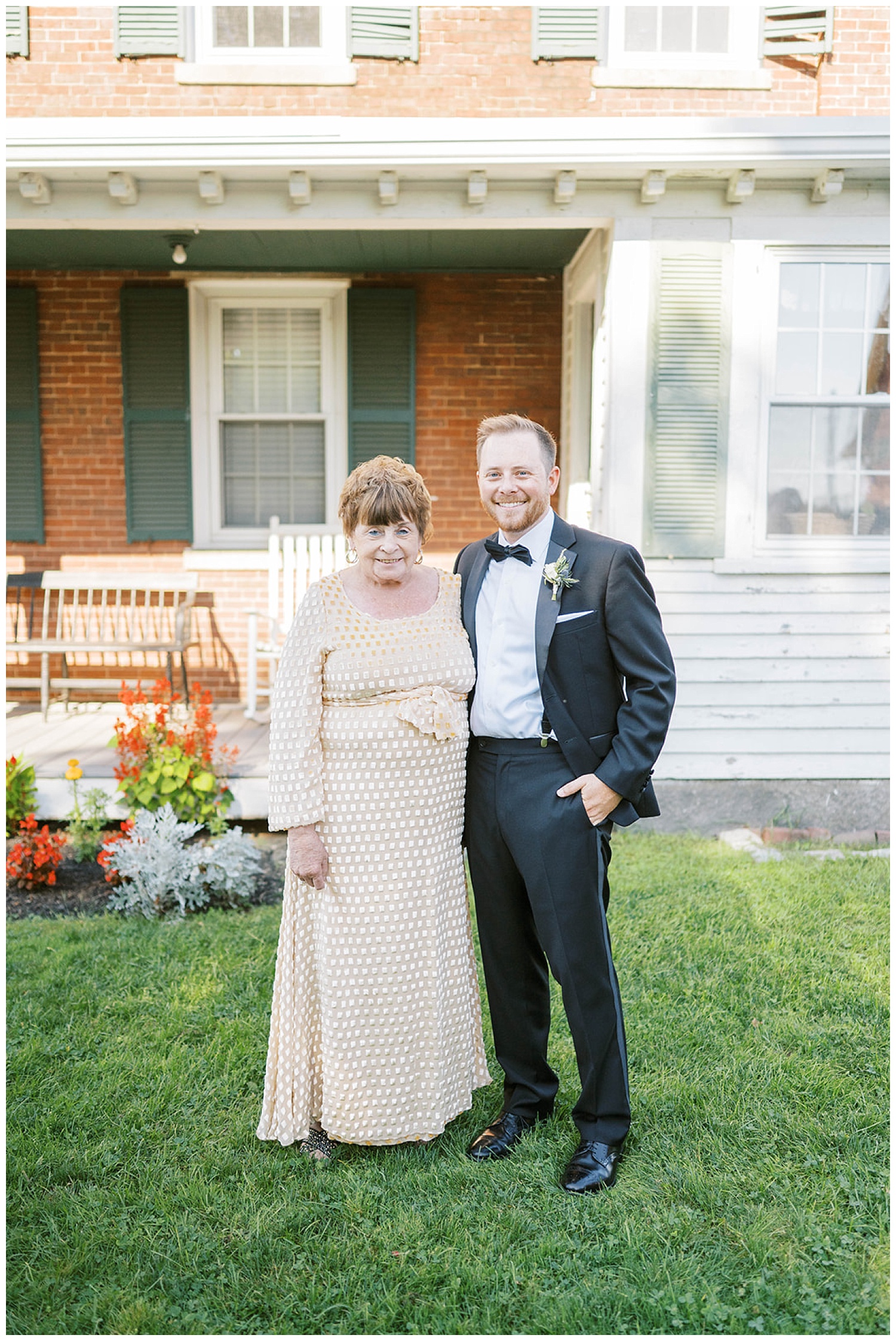 groom posing with his grandmother outside