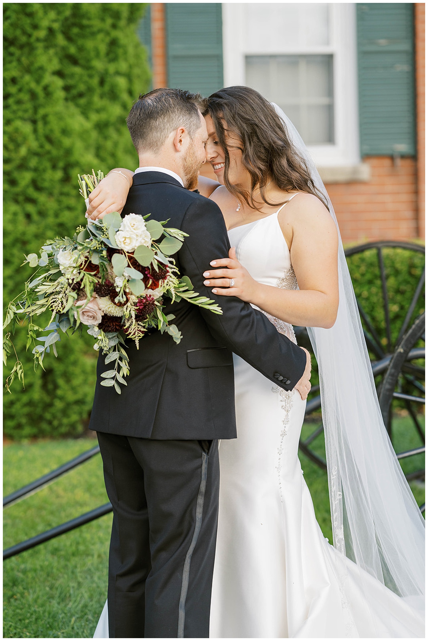bride and groom touching foreheads