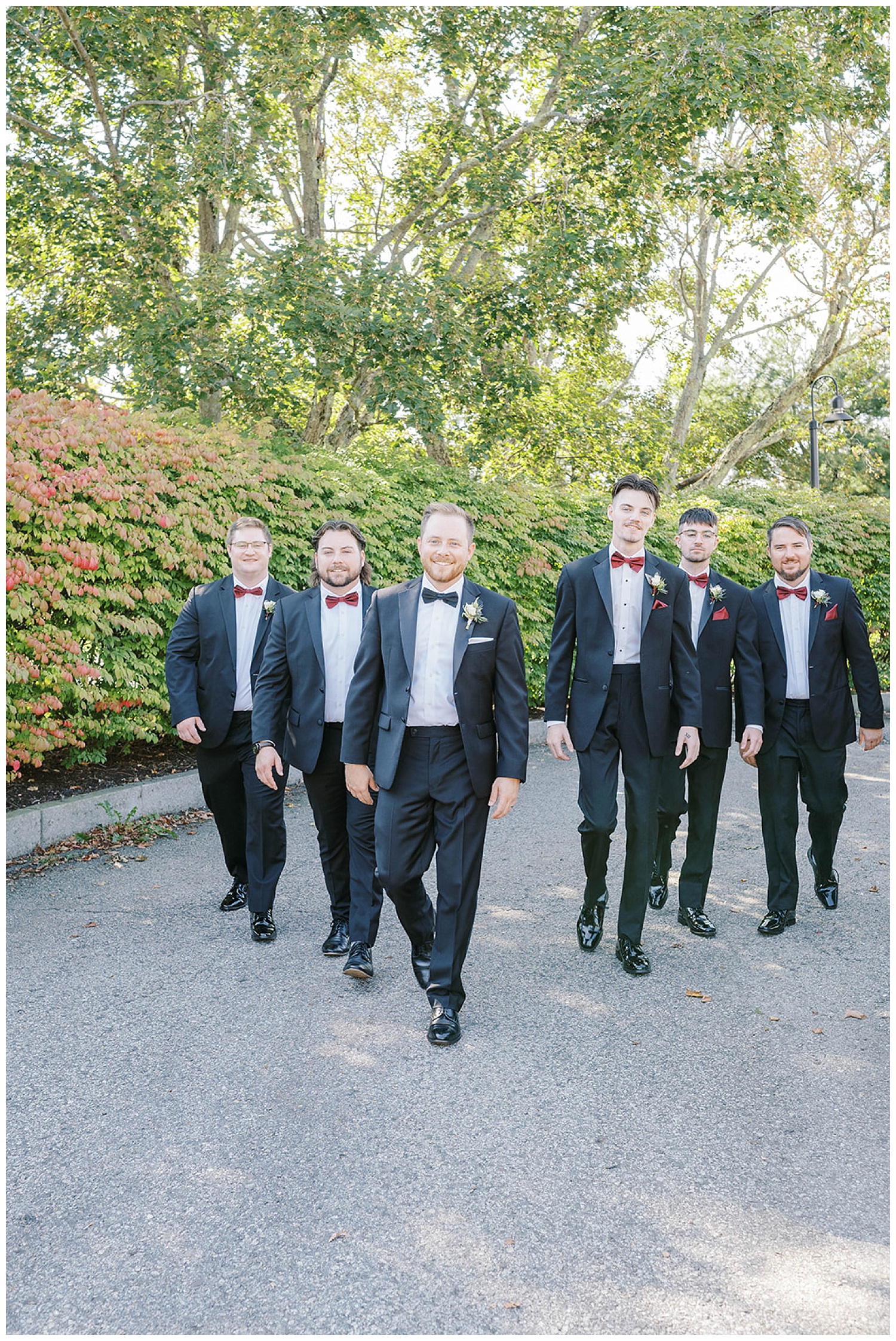 groomsmen walking towards the camera