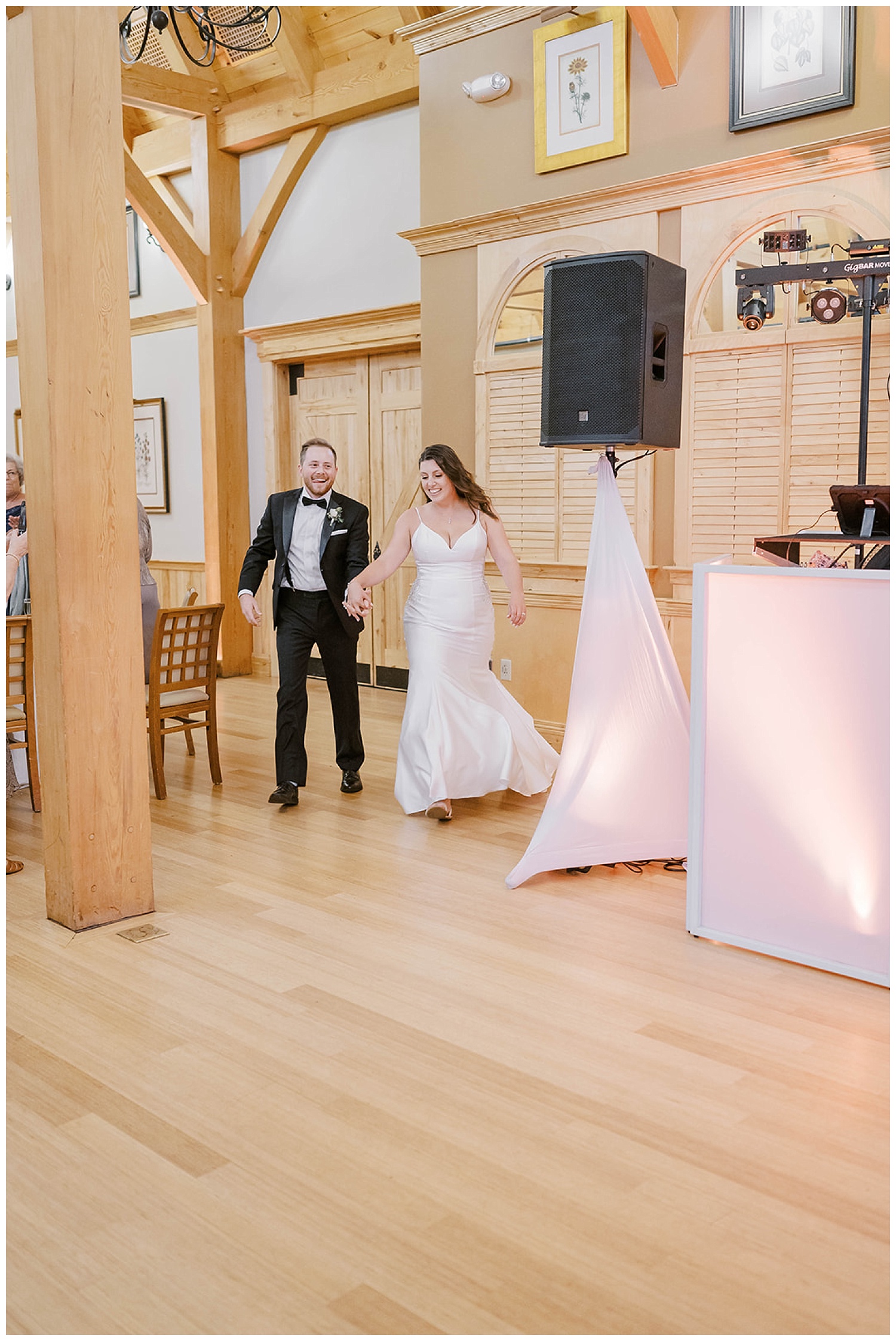 bride and groom walking into their reception