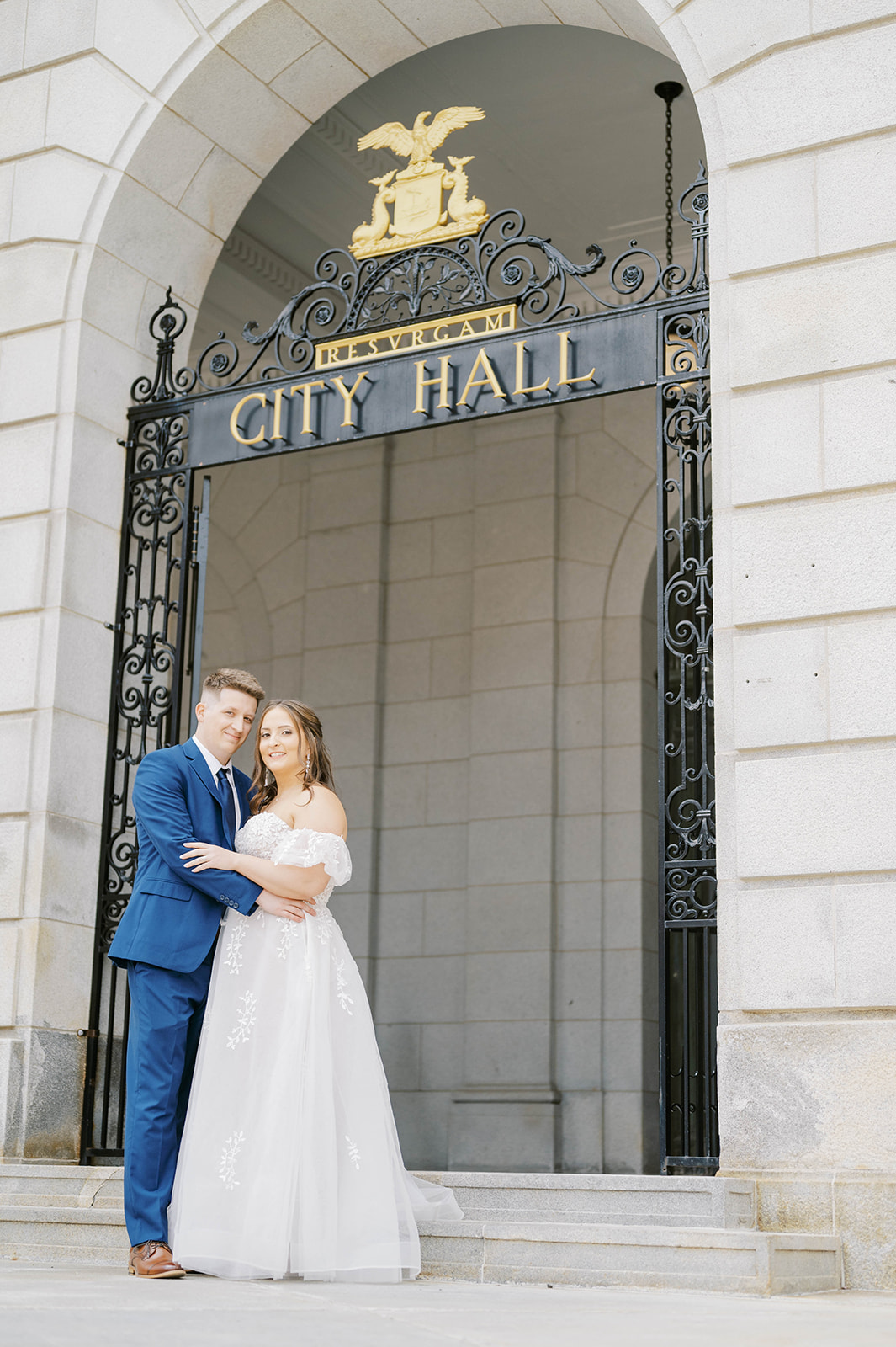 wedding couple standing in front of Portland City Hall