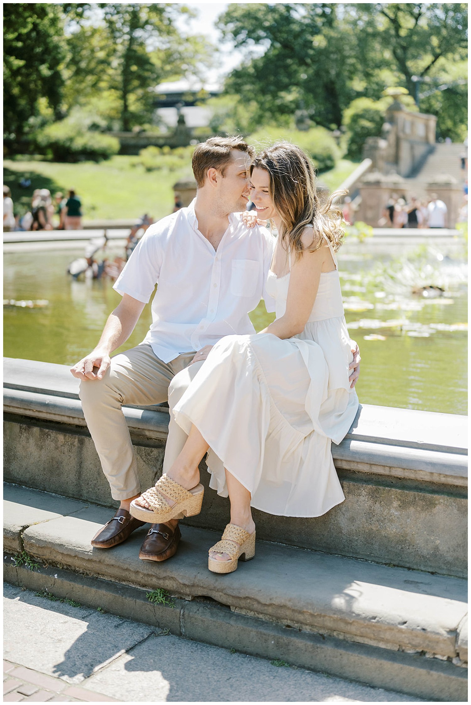 couple sitting by the fountain in Central Park in New York