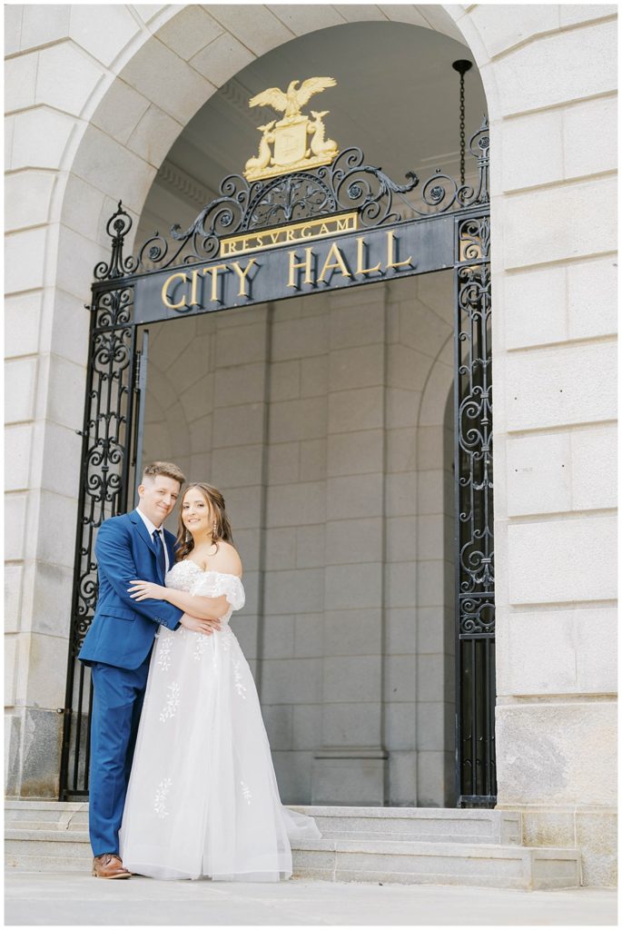 wedding couple standing outside in front of Portland City Hall