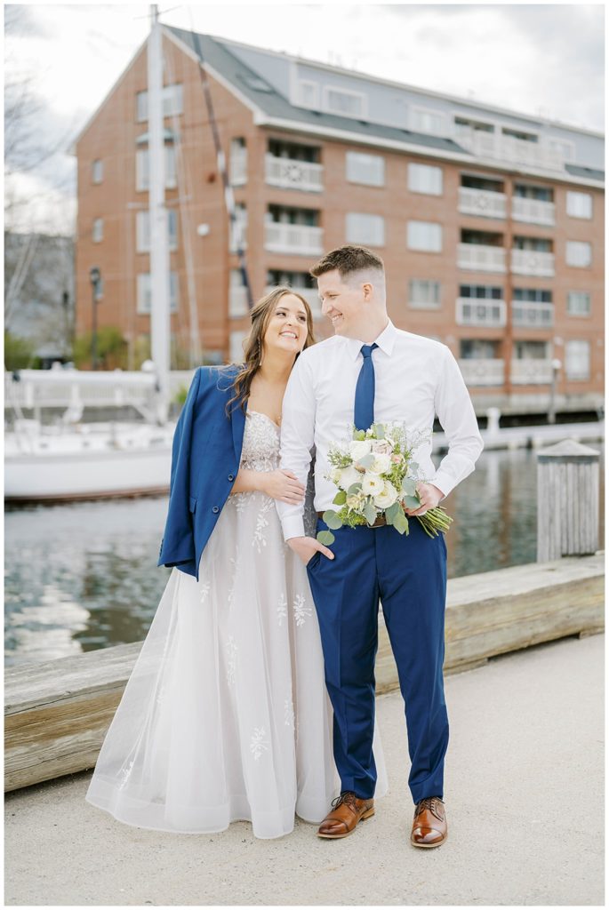 couple posing together next to the water in Portland Maine