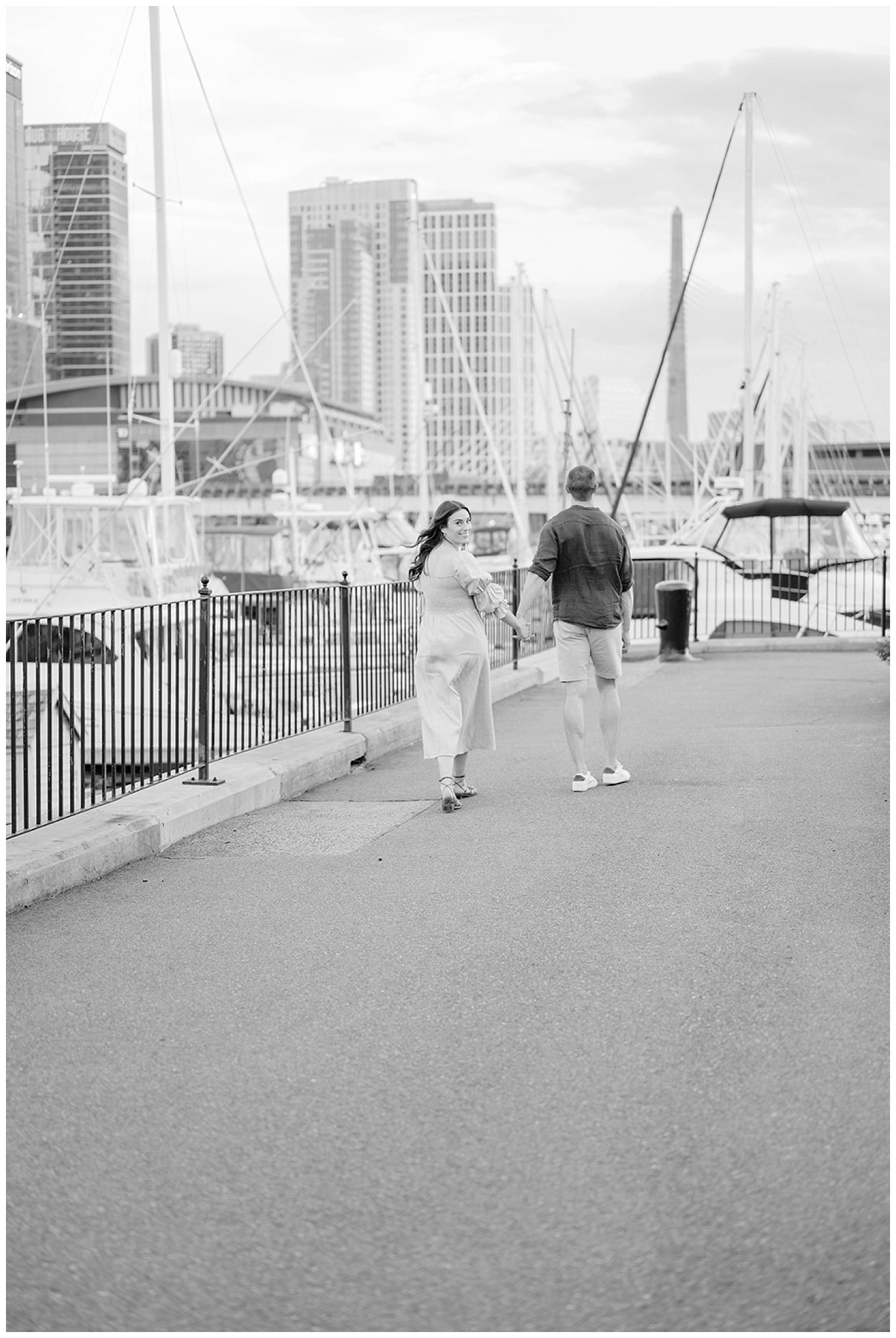 couple walking near the water in Boston at engagement session