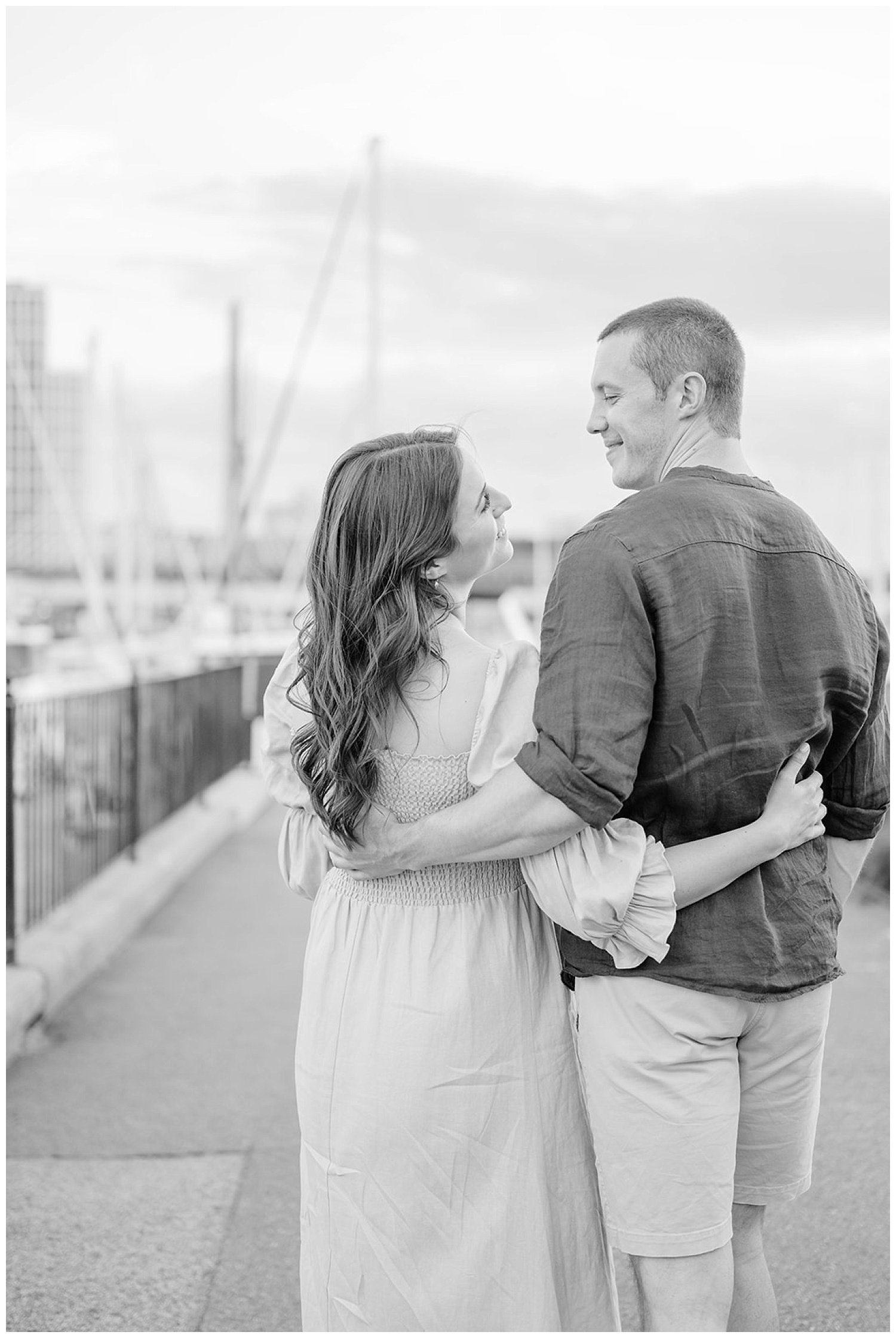 couple smiling at Boston engagement session near the water 