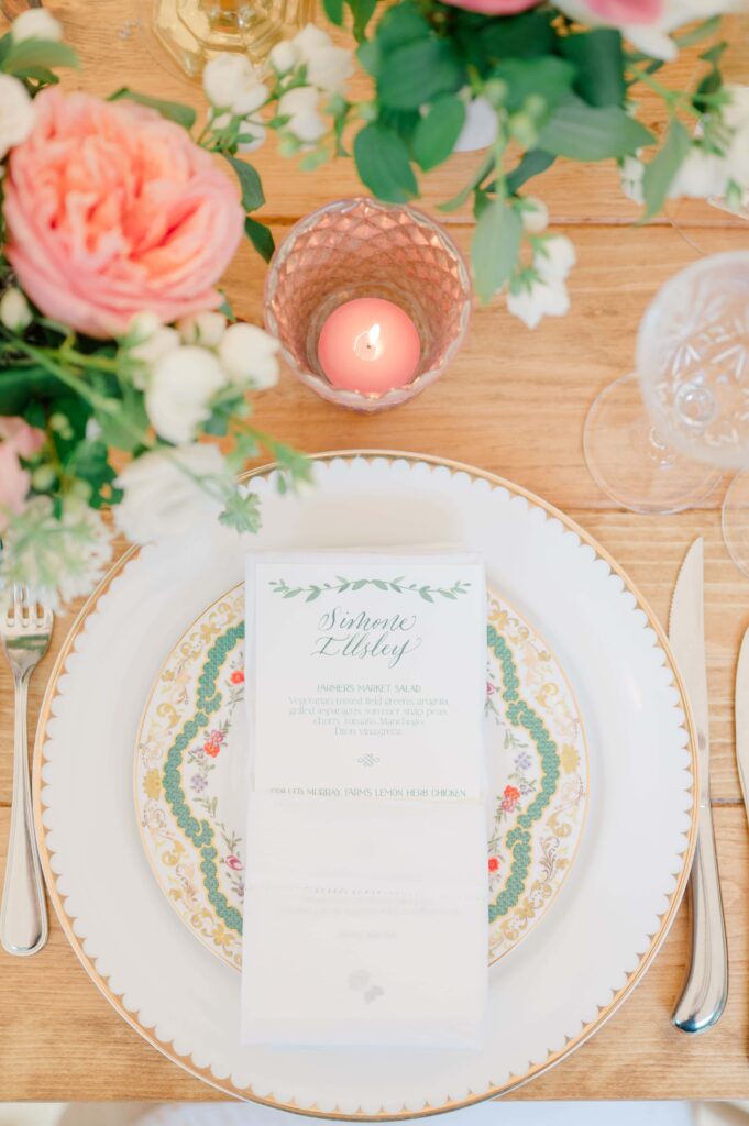 Romantic garden-inspired place setting with custom calligraphy menu.