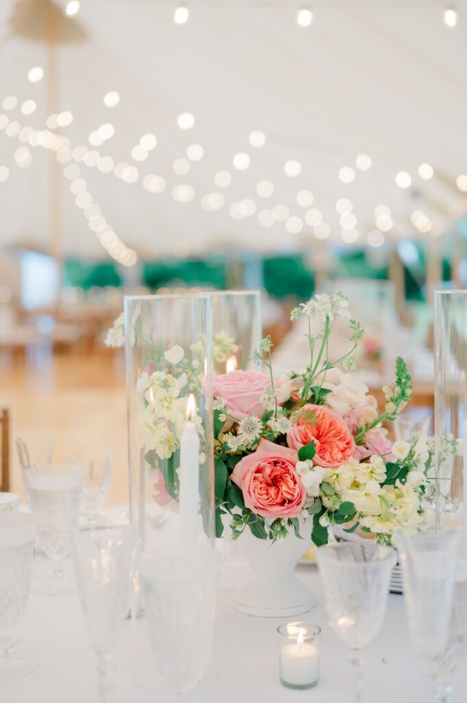 Elegant floral centerpiece and vintage china at a Newport wedding reception.