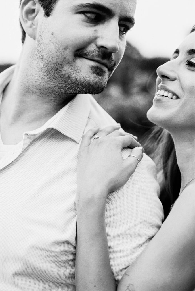 couple snuggle close during engagement session