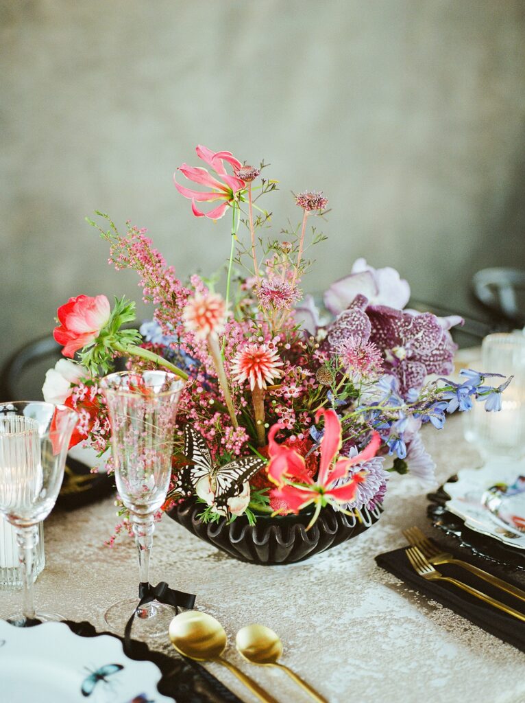 colorful compote arrangement of pinks, purples, and blues