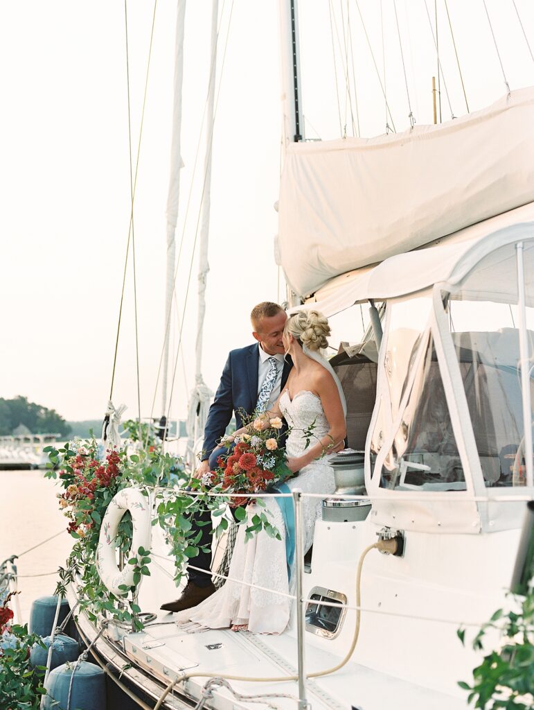 couple exchange a quiet moment on a boat during their wedding