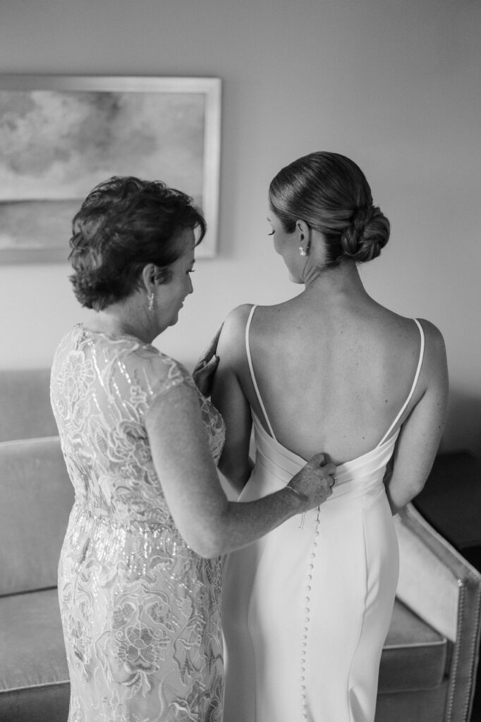 Bride getting ready with her mother’s help before the ceremony at Wentworth by the Sea.