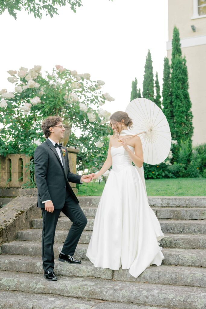 A candid moment of the couple laughing together during golden hour portraits