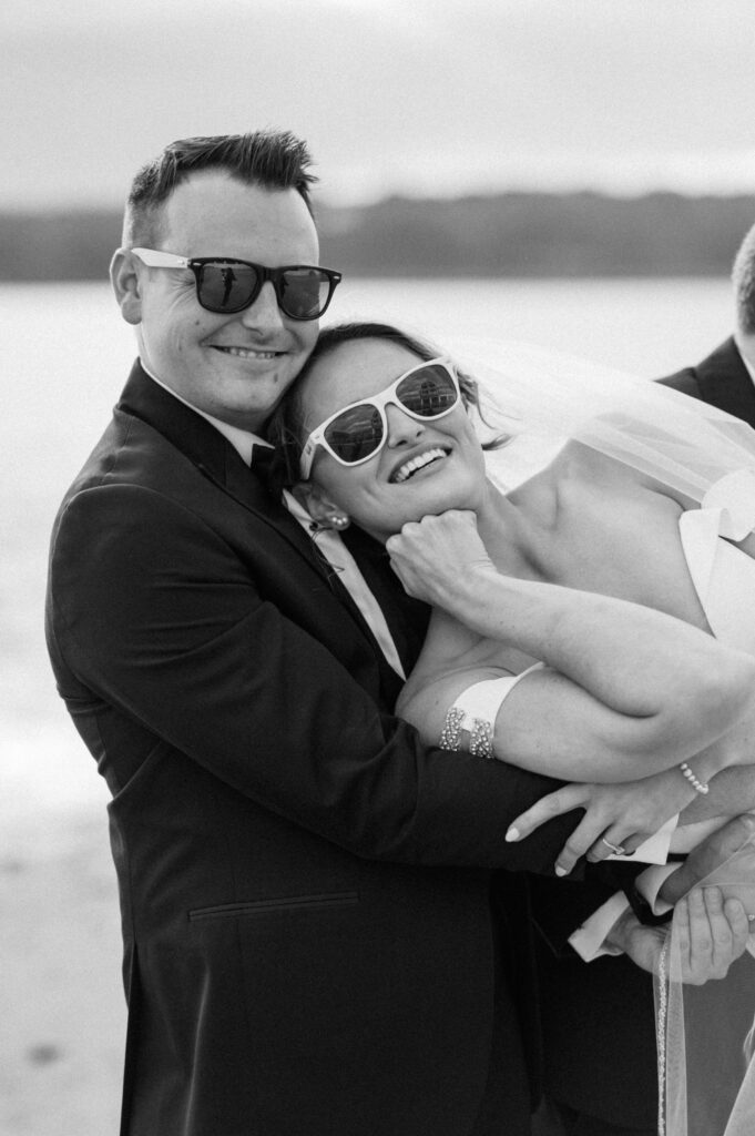Joyful bride and groom laughing together at their coastal Beauport Hotel wedding