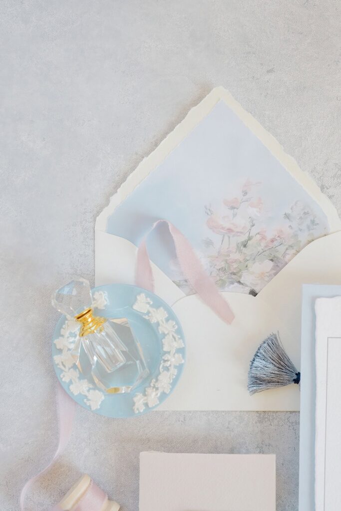 Wedding invitation flat lay at Aldrich Mansion in Warwick, Rhode Island