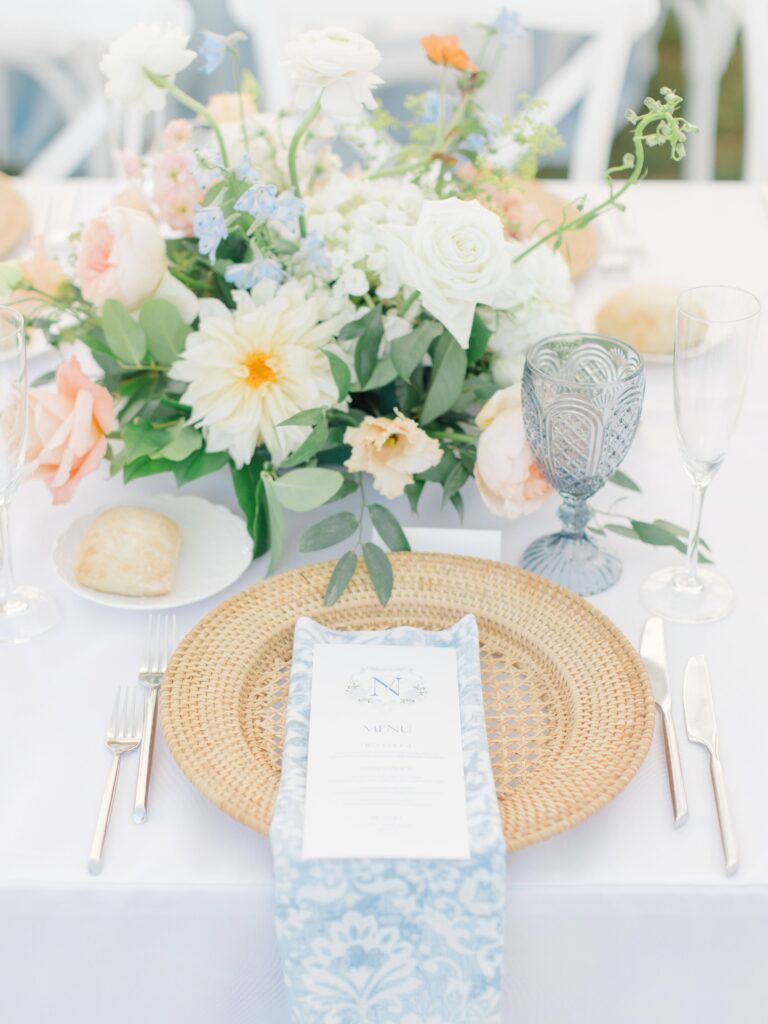 Blue printed napkins and custom table numbers styled for a Rhode Island seaside wedding.