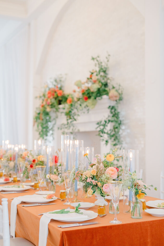 Vertical view of floral fireplace installation at Belle Mer wedding reception.
