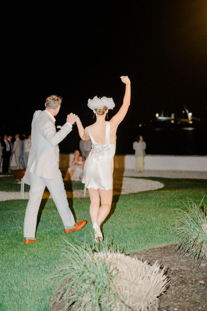 Fun nighttime wedding portrait of bride and groom during their Belle Mer reception in Newport, Rhode Island.
