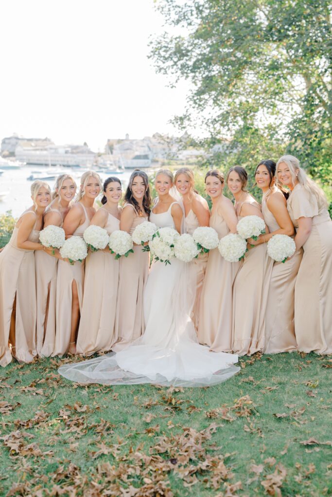 Wedding party portrait at Wychmere Beach Club with bridesmaids in champagne dresses