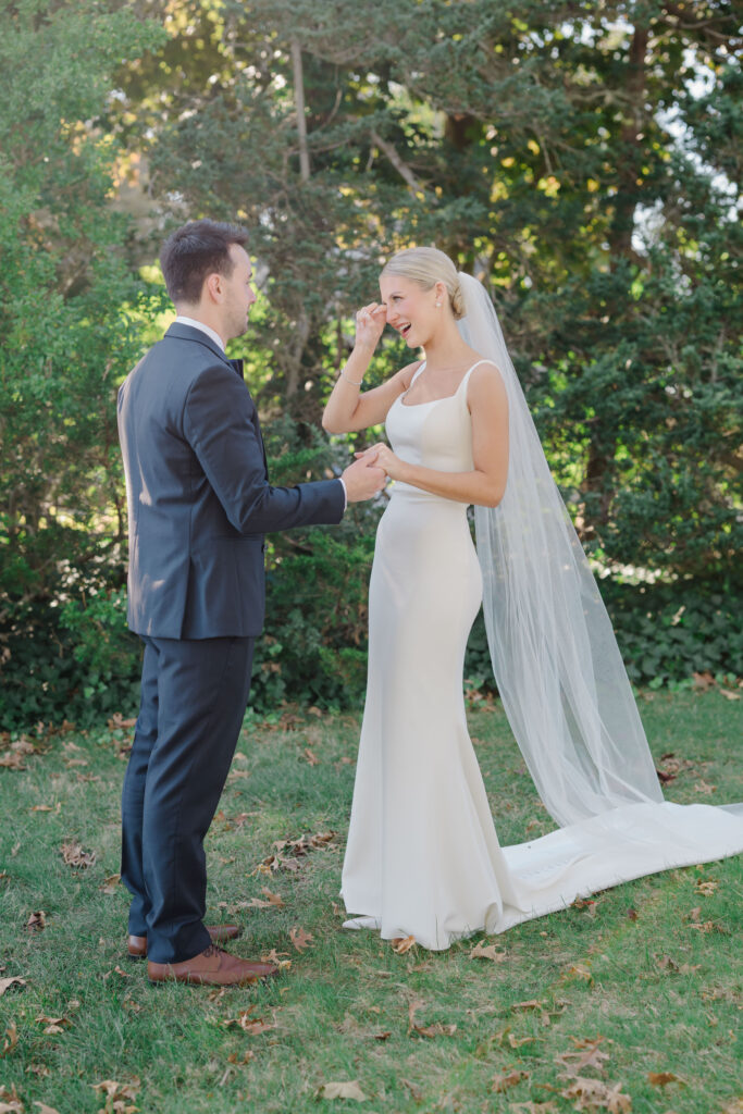 Groom wiping tears during first look at Wychmere Beach Club