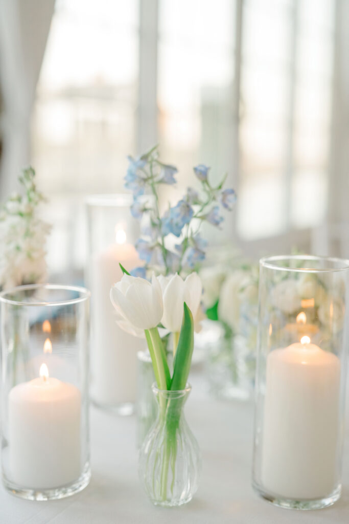 Coastal-inspired candle and floral reception table decor at Wychmere Beach Club