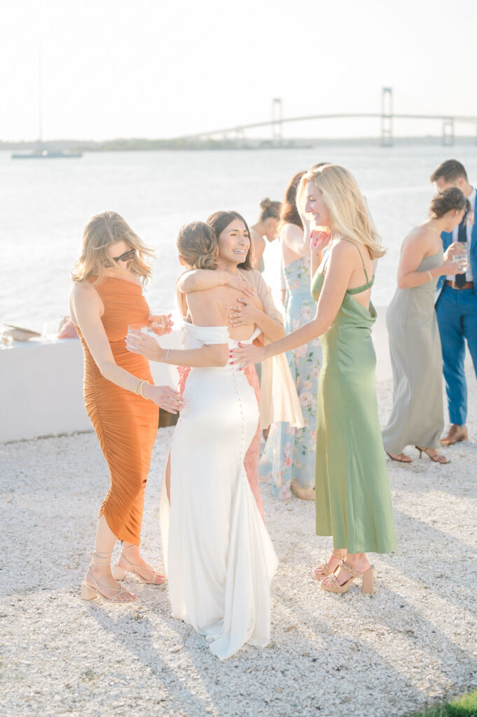 Candid cocktail hour moments at Belle Mer with guests enjoying ocean views.