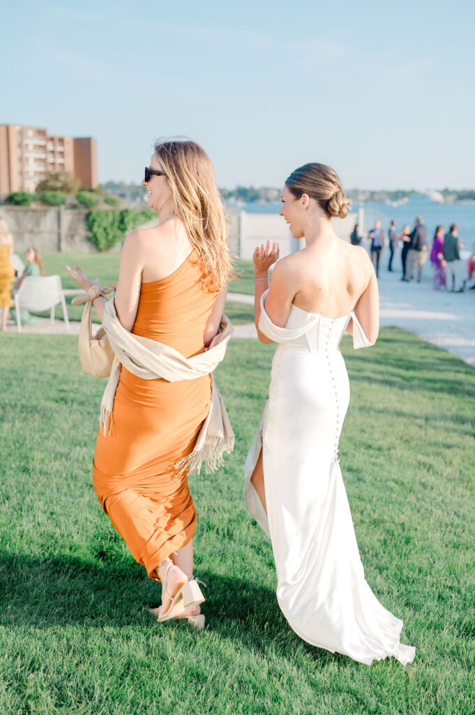 Bride and guests mingling on the lawn during cocktail hour at Belle Mer, Newport.