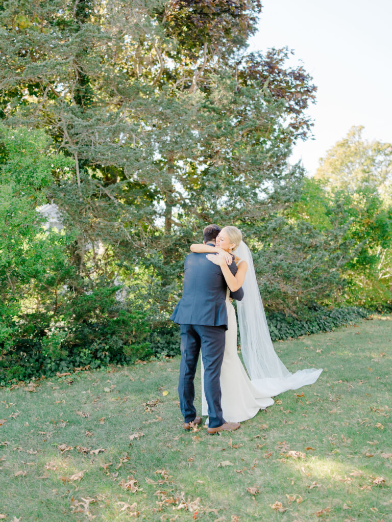 Emotional first look hug between bride and groom at Wychmere