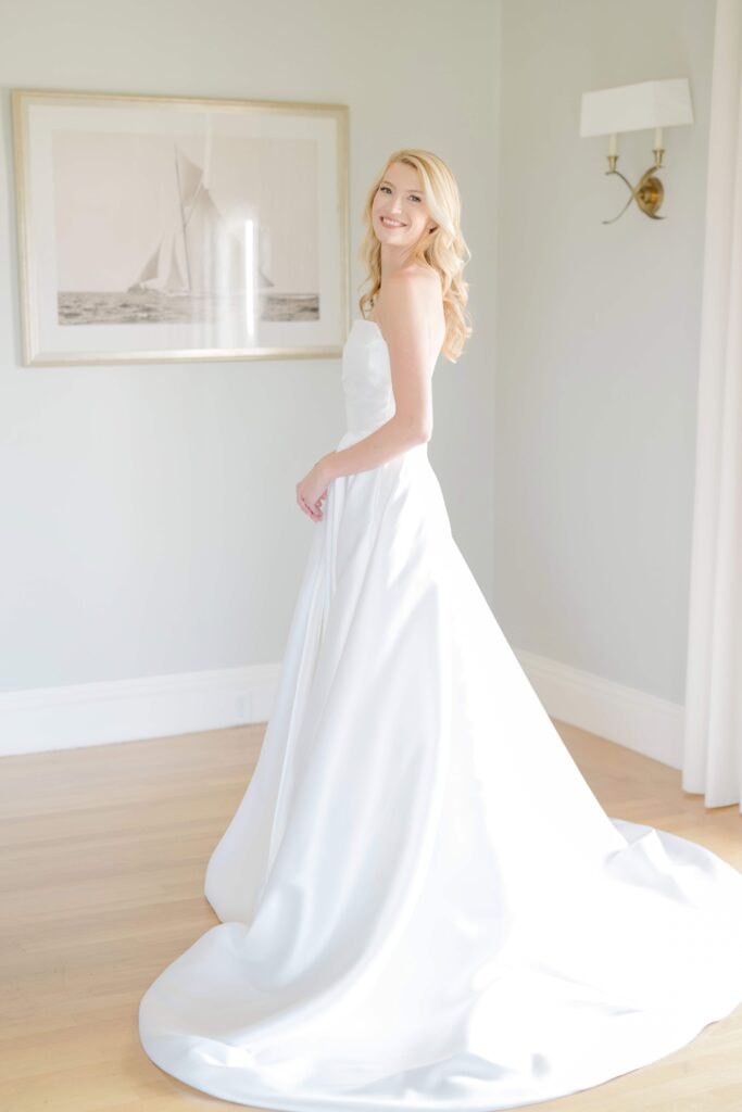 Bride getting ready inside the Eisenhower House bridal suite, preparing for her Newport Rhode Island wedding day.