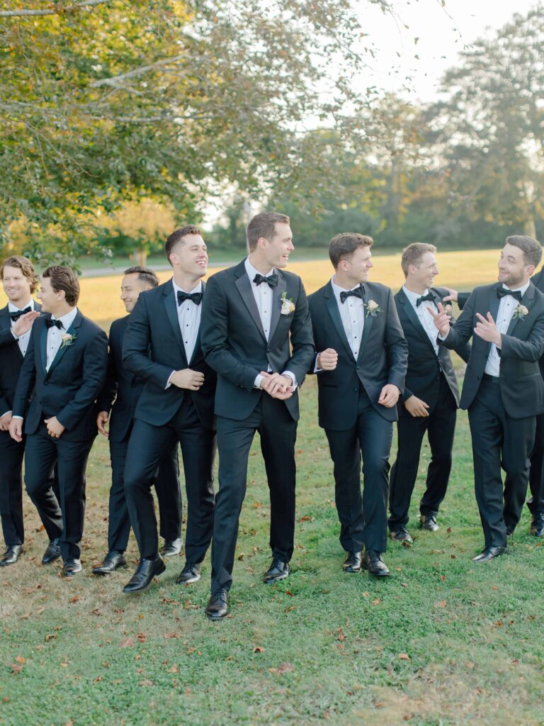Groom laughing with groomsmen before ceremony at the historic Eisenhower House.