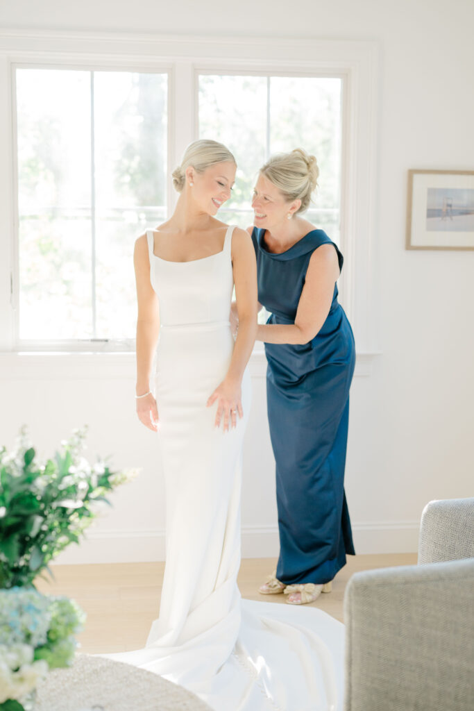 Bride and mother sharing a quiet moment before ceremony at Wychmere Beach Club