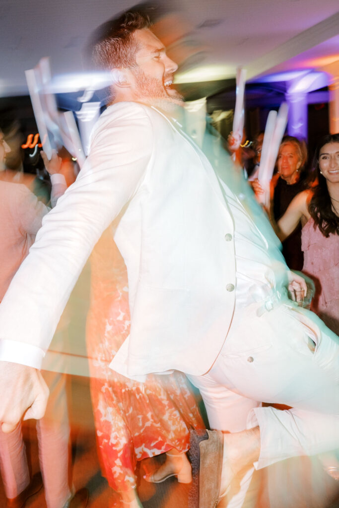 Fun nighttime wedding portrait of bride and groom during their Belle Mer reception in Newport, Rhode Island.