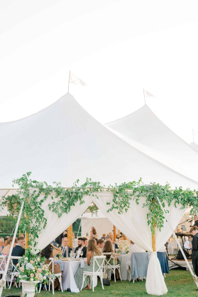 Soft sunset glow over sailcloth tent reception at Eisenhower House in Newport, Rhode Island.