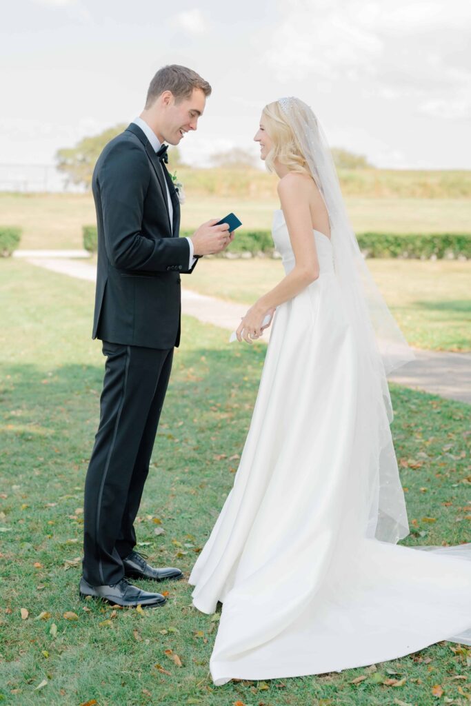 Bride and groom sharing private handwritten vows before their Newport ceremony.