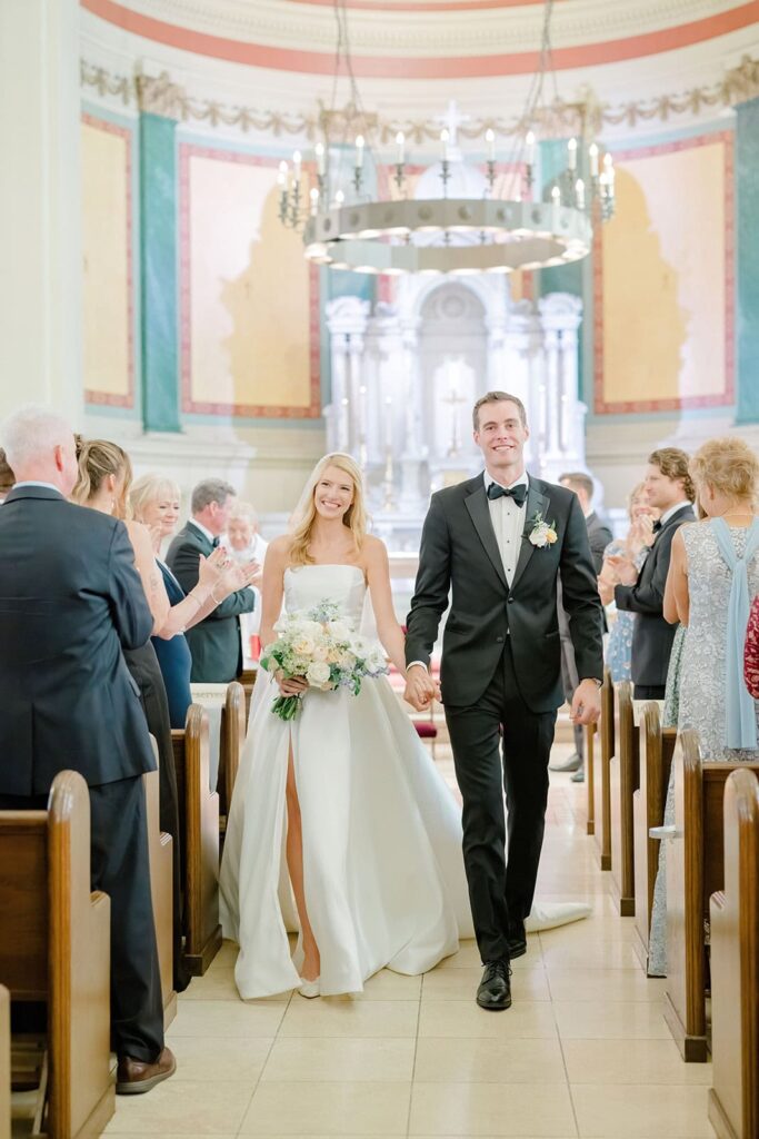 Bride walking down the aisle of historic St. Joseph’s Church in Newport, Rhode Island.