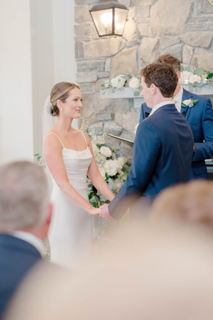 Bride and groom exchanging vows during their Wentworth by the Sea wedding ceremony.