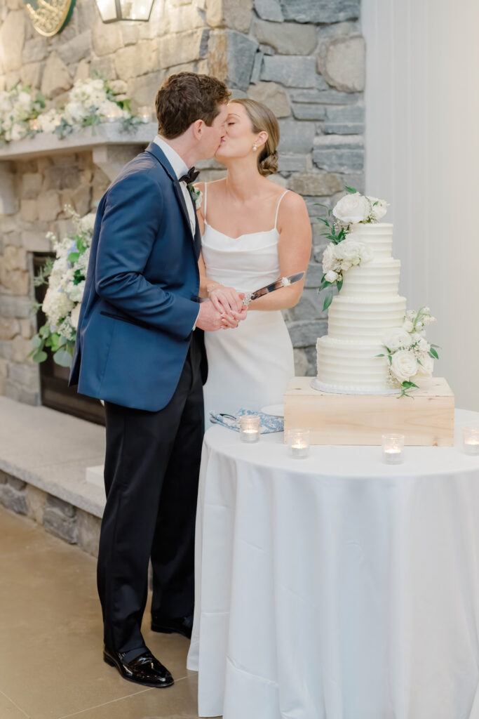 Bride and groom cutting their wedding cake during the reception at Wentworth by the Sea.