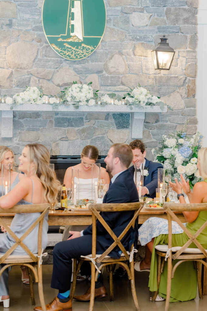 Candid moment of the bride laughing with guests at her Wentworth by the Sea wedding reception.