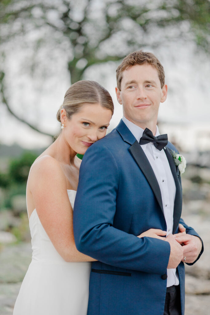Romantic coastal wedding portrait of bride and groom at Wentworth by the Sea Country Club.