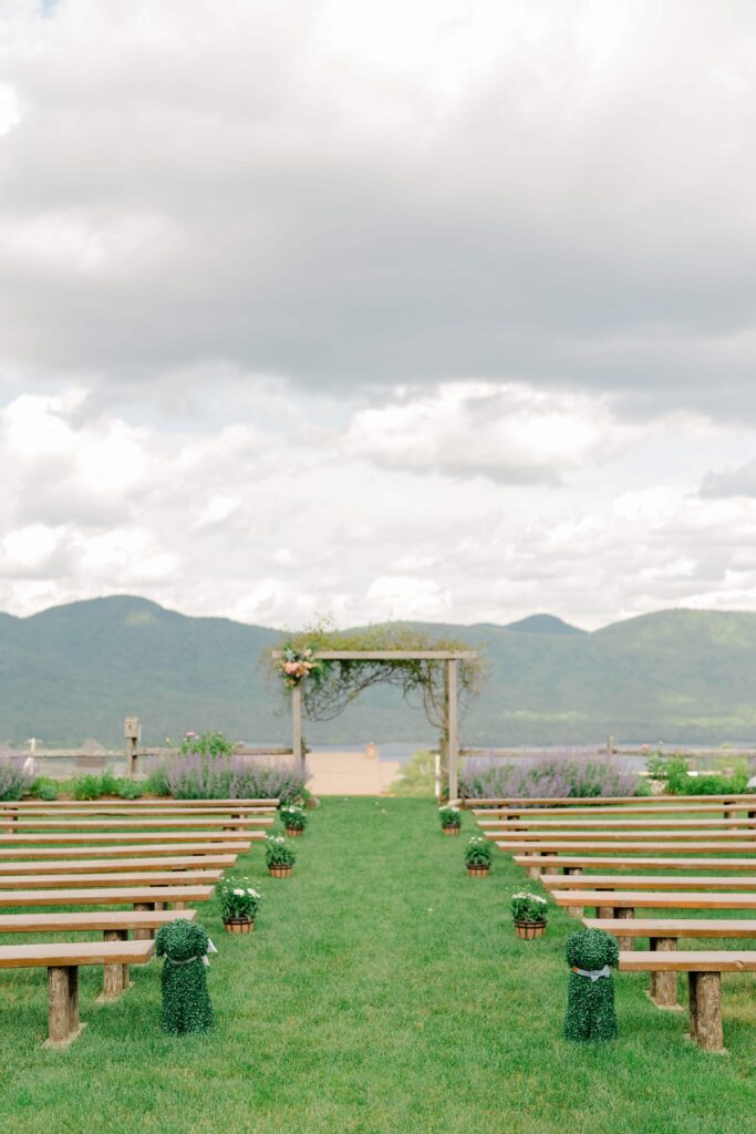 Outdoor wedding ceremony with sweeping Green Mountain views in Vermont.