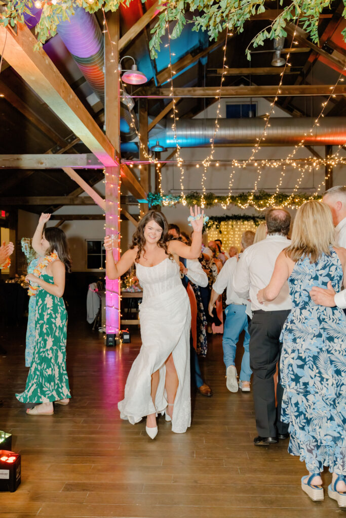 Lively dance floor celebration with family and friends at Mountain Top Resort Vermont wedding.