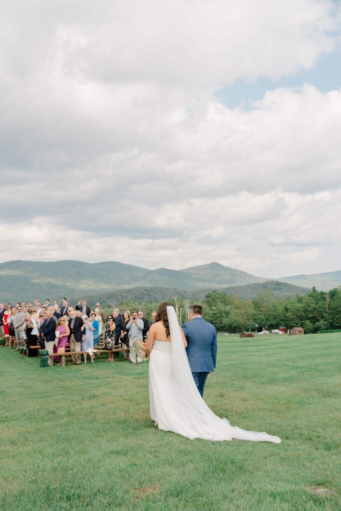 Bride walking down the aisle at Mountain Top Resort wedding ceremony.