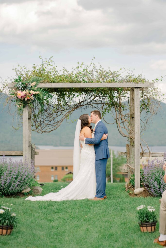 First kiss at the ceremony overlooking the Vermont mountains.