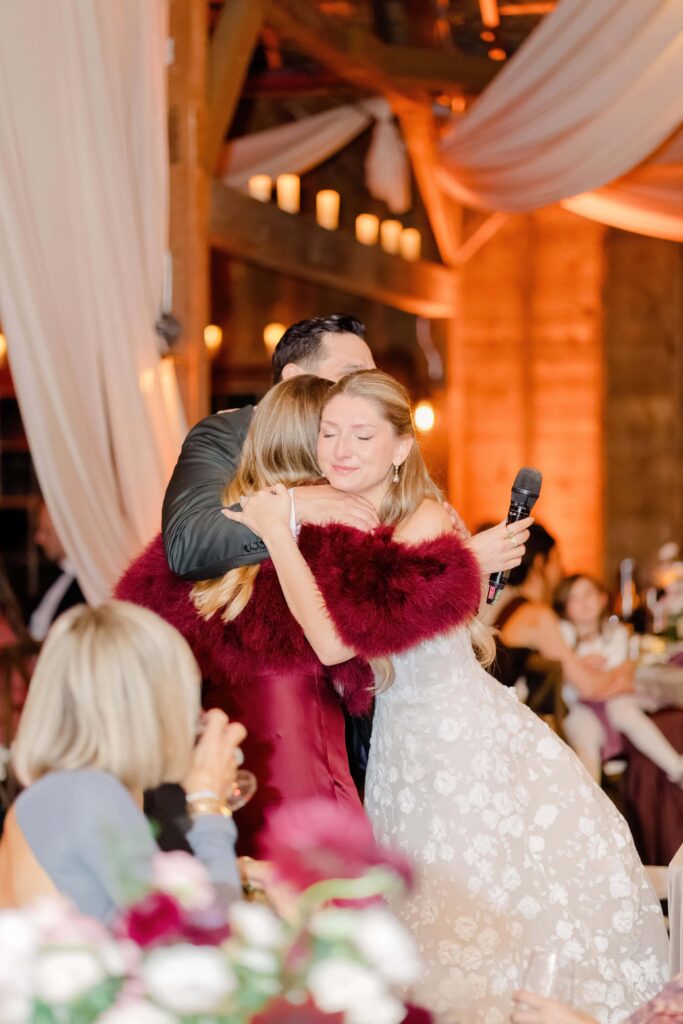Emotional embrace shared during a heartfelt reception speech at a Stonover Farm wedding