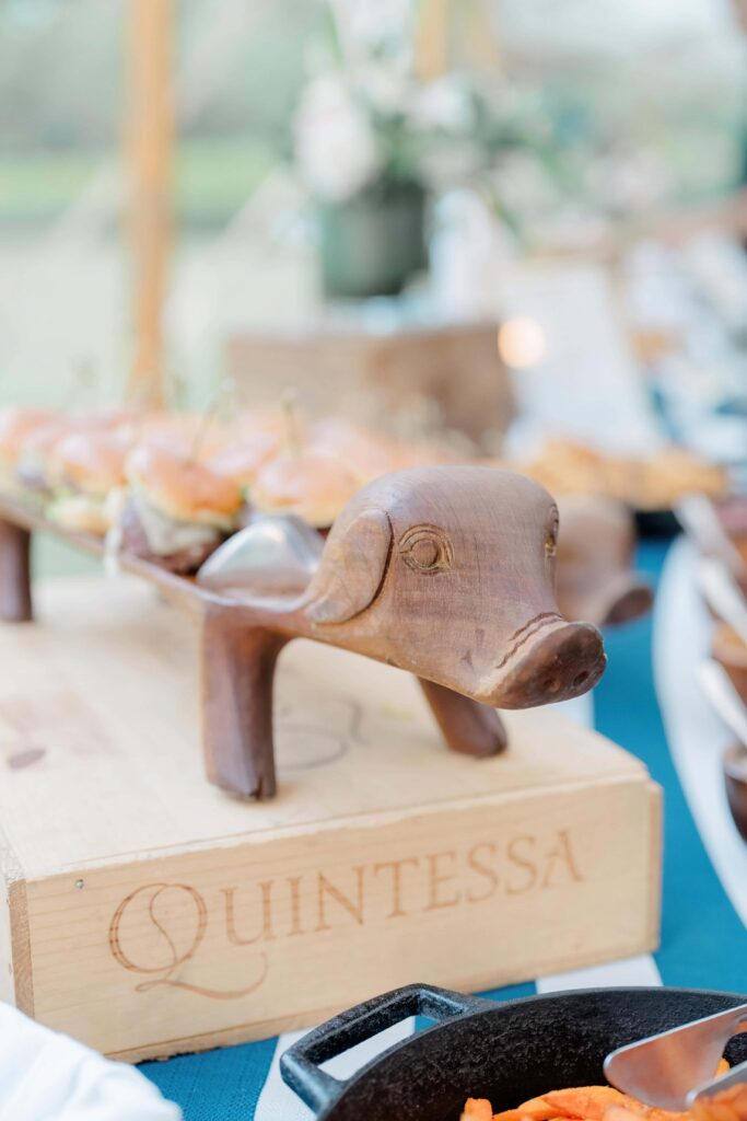 Guests mingling and reconnecting during a Vermont wedding welcome party, sharing laughter and conversation.
