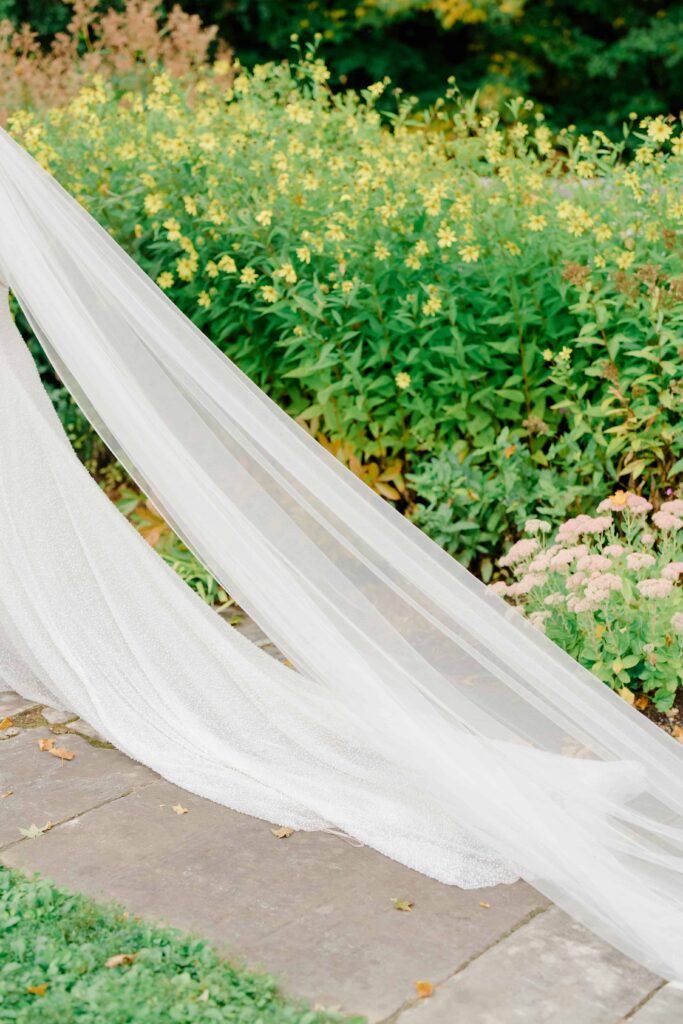 Bride and groom walking together during portrait time at their Vermont wedding, sharing an intimate moment.