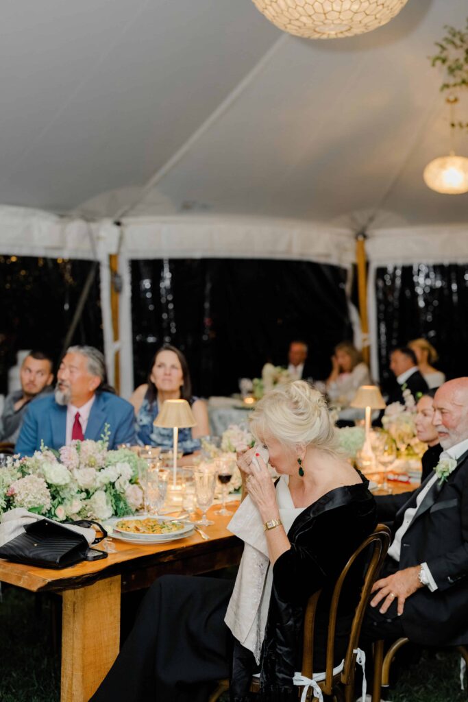 Candid moments captured throughout a Vermont wedding reception, showing genuine emotion and celebration.
